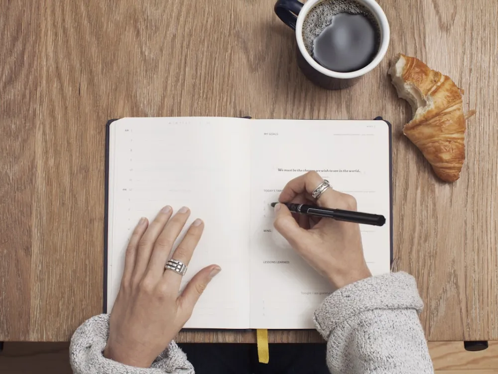 Open notebook with handwritten story notes