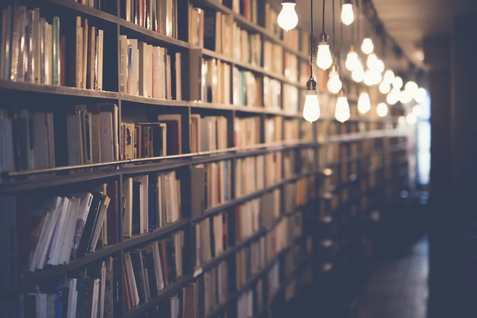 Open books stacked for reading and review